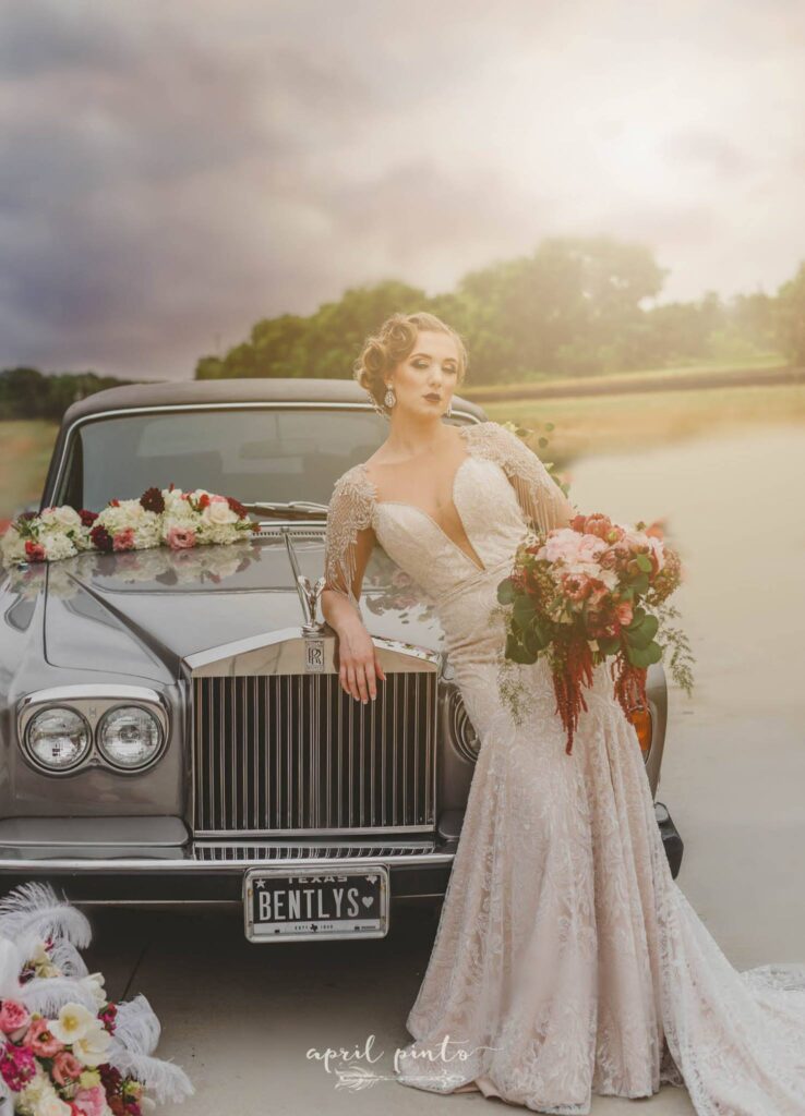 bride leaning against bentley car
