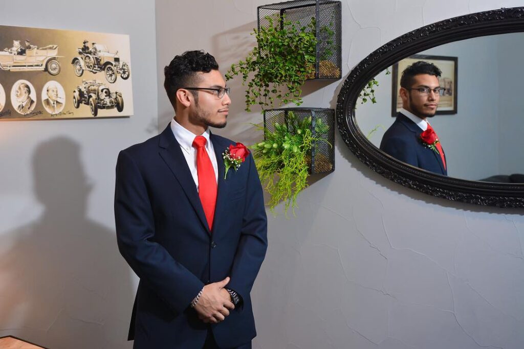 groom looking in mirror